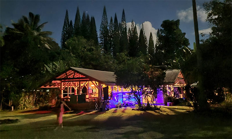 Wrapped in the bright festive colors of Diwali, the outdoor kitchen and dining area of the Coco Wasi retreat center in sunny Kapoho of Pahoa, Hawaii